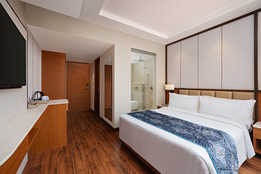 deluxe-room-bedroom.jpg